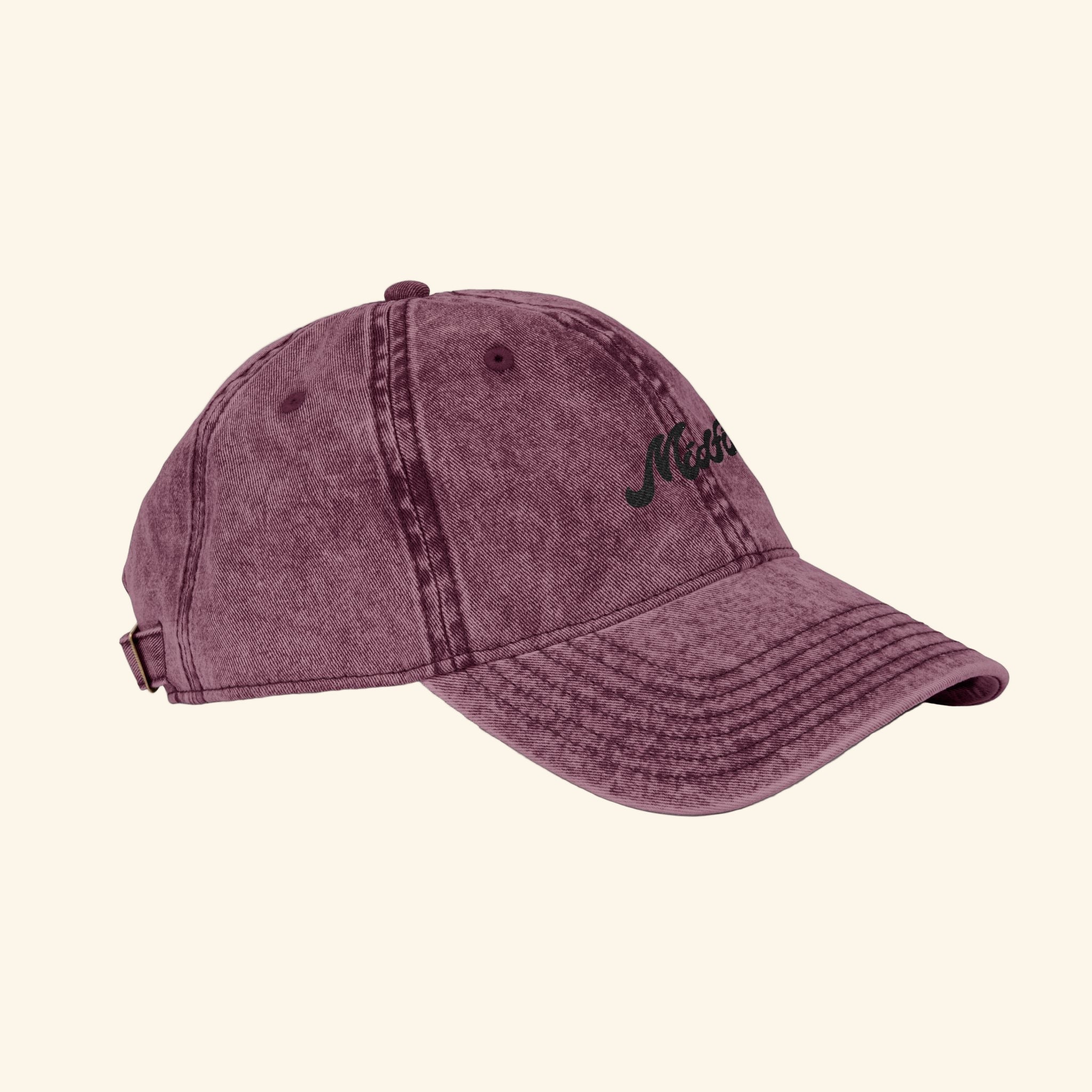 Maroon baseball cap with a logo on a white background