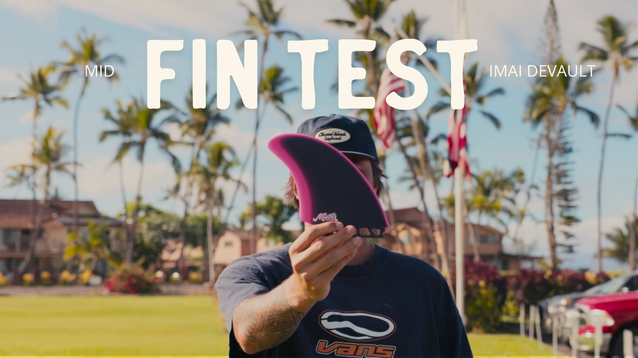 Person holding a pink and black fin with text overlay in an outdoor setting