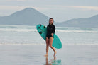Estefi Hotton, resident artist, walking in from the surf